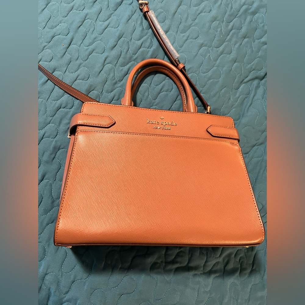 Kate spade satchel bag, mauve color. Never been used.